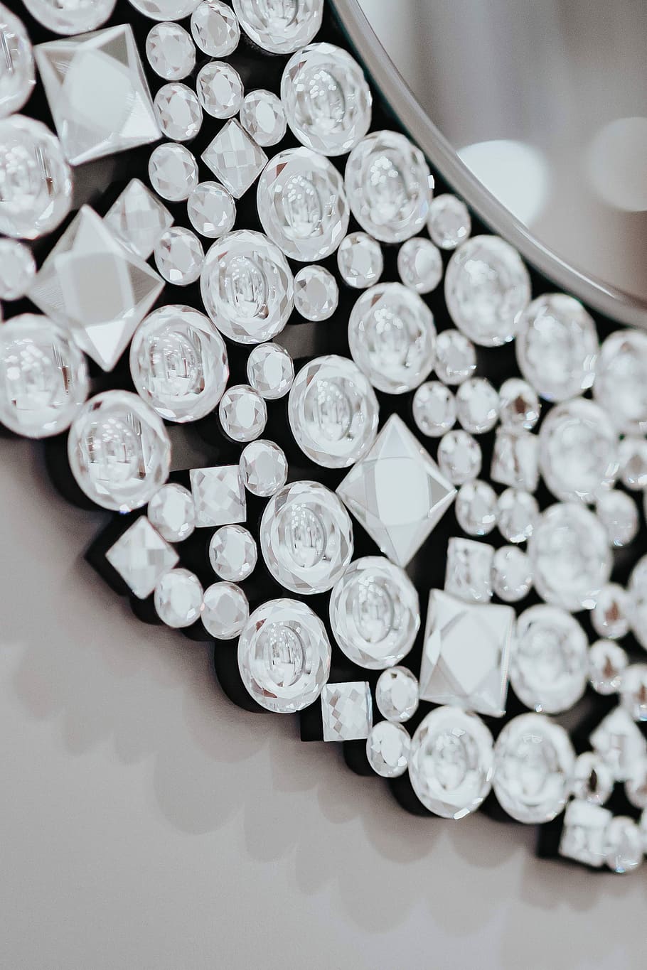 round mirror, adorned, crystals, Beautiful, round, mirror, reflection, elegant, decoration, fancy, crystal, ornamental, shiny, sparkling, currency, large group of objects, coin, wealth, no people, finance, abundance, indoors, still life, table, close-up, high angle view, arrangement, business, shape, white color, metal, geometric shape, circle, design, luxury, 2K
