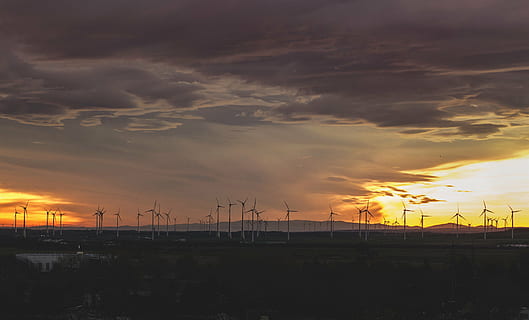 windmills, cloudy, day, wind, turbines, field, grass, landscape, outdoors, nature, sky, clouds, sunset, dusk, no people, cloud - sky, tranquility, silhouette, tranquil scene, beauty in nature, scenics, orange color, scenics - nature, electricity, electricity pylon, architecture, technology, sun, fuel and power generation, built structure, power line, power supply, 4K, CC0, public domain, royalty free
