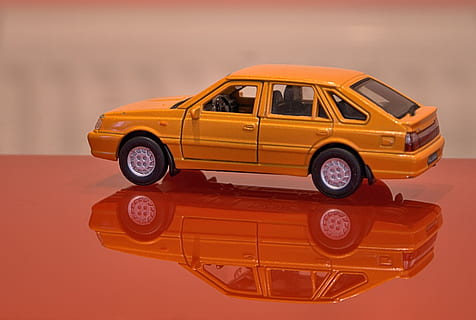 model, polonaise, car, automatic, orange, mode of transportation, transportation, yellow, no people, motor vehicle, studio shot, taxi, retro styled, land vehicle, yellow taxi, reflection, antique, indoors, technology, single object, toy car, close-up, toy, wheel, 2K, CC0, public domain, royalty free
