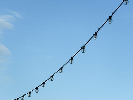 string light, bulb, string, lights, day, time, blue, sky, string lights, bulbs, barbed wire, safety, razor wire, protection, outdoors, no people, close-up, chain, metal, nature, wire, hanging, low angle view, security, clear sky, fence, copy space, swing, boundary, 4K
