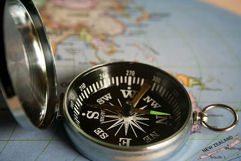 silver-colored compass, magnetic compass, navigation, direction, compass, travel, journey, exploration, adventure, map, east, south, guidance, orienteering, orientation, planning, north, discovery, searching, west - Direction, cartography, physical Geography, navigational compass, close-up, finance, world map, no people, navigational equipment, indoors, accuracy, two objects, text, business, still life, 2K, CC0, public domain, royalty free