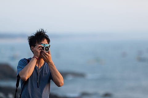 photographer taking photo, Photographer, photo, technology, camera, lens, man, photography, tech, outdoors, sea, men, binoculars, one Person, camera - Photographic Equipment, adult, people, nature, looking, color Image, vacations, beach, photographing, holding, one man only, only men, adults only, water, portrait, focus on foreground, young adult, glasses, standing, waist up, front view, leisure activity, casual clothing, horizon, hair, headshot, hairstyle, obscured face, 4K, CC0, public domain, royalty free