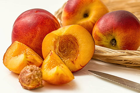 sliced peach fruit, nectarine, peach, fruit, deciduous, juicy, sweet, yellow, ripe, healthy, fresh, organic, raw, vitamin, tasty, vegetarian, diet, dieting, food, summer fruit, eating healthy, food and drink, healthy eating, slice, freshness, white background, no people, studio shot, close-up, wellbeing, sweet food, still life, group of objects, group, orange color, dessert, healthy lifestyle, snack, vegetarian food, 5K, CC0, public domain, royalty free