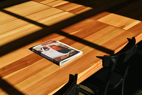 magazine, top, rectangular, beige, wooden, table, brochures, tabletop, display, advertise, wood - material, indoors, no people, seat, chair, high angle view, furniture, communication, technology, food and drink, wireless technology, wood, photography themes, still life, day, close-up, mobile phone, 5K, CC0, public domain, royalty free