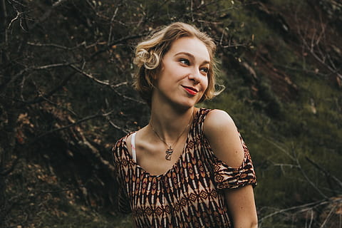 woman, wearing, brown, shirt, leafless tree trunk, black, tribal, cold-shoulder, top, brown shirt, tree trunk, women, outdoors, one Person, nature, people, females, caucasian Ethnicity, beauty, beautiful, young Adult, blond Hair, adult, summer, portrait, young Women, one Woman Only, smiling, beauty In Nature, only Women, one young woman only, leisure activity, real people, beautiful woman, front view, lifestyles, forest, land, focus on foreground, looking at camera, day, casual clothing, tree, hair, hairstyle, 5K, CC0, public domain, royalty free
