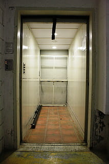 elevator, door, light, architecture, indoors, empty, flooring, entrance, building, no people, wall - building feature, lighting equipment, arcade, built structure, corridor, illuminated, ceiling, direction, tile, absence, the way forward, abandoned, tiled floor, 4K, CC0, public domain, royalty free