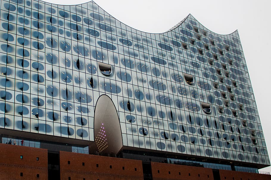 blue, white, building low-angle photography, daytime, architecture, building, infrastructure, structure, establishment, apartment, windows, condominium, hotel, built structure, building exterior, city, skyscraper, city life, window, low angle view, communication, day, office building exterior, no people, nature, sky, modern, outdoors, office, pattern, location, place, exterior, neighborhood, 2K