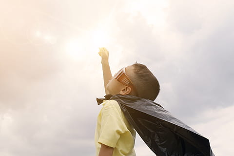 sky, person, sunglasses, clouds, boy, child, kid, little, plastic, superhero, wear, young, one person, childhood, low angle view, human arm, nature, day, males, offspring, arms raised, sunlight, casual clothing, men, boys, lens flare, waist up, standing, outdoors, innocence, human limb, hand raised, 4K