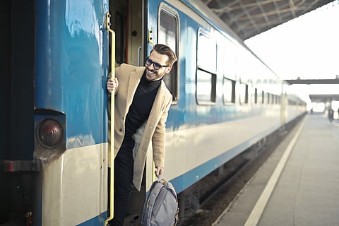 man on train, man, wearing, beige, 2-button, 2- button suit jacket, holding, gray, backpack, train, engine, platform, male, rail transportation, public transportation, transportation, mode of transportation, railroad station platform, train - vehicle, one person, railroad station, young men, real people, young adult, travel, three quarter length, standing, lifestyles, casual clothing, men, passenger, track, outdoors, station, 5K, CC0, public domain, royalty free