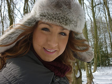 winter, snowfall, outdoor, portrait, smiling, warm clothing, looking at camera, headshot, cold temperature, young adult, one person, happiness, young women, snow, beautiful woman, front view, adult, women, tree, clothing, hood - clothing, outdoors, hairstyle, 2K, CC0, public domain, royalty free