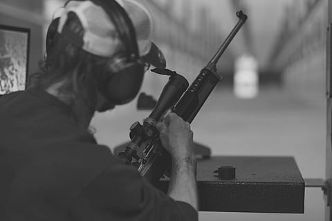 grayscaled photo, man, holding, rifle, shooting range, scope, sniper, target, gun, bullet, redneck, firing range, one person, concentration, skill, real people, men, working, accuracy, waist up, occupation, headshot, selective focus, focus on foreground, day, side view, protection, music, safety, portrait, 4K, CC0, public domain, royalty free