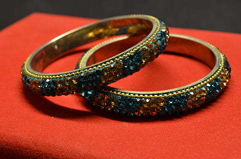 bracelets, bangles, valuables, accessory, bijouterie, jewelry, wealth, fashion, luxury, studio shot, red, ring, colored background, bangle, arts culture and entertainment, no people, gold, bracelet, close-up, gold colored, indoors, elegance, metal, diamond - gemstone, shiny, expense, precious gem, 4K, CC0, public domain, royalty free