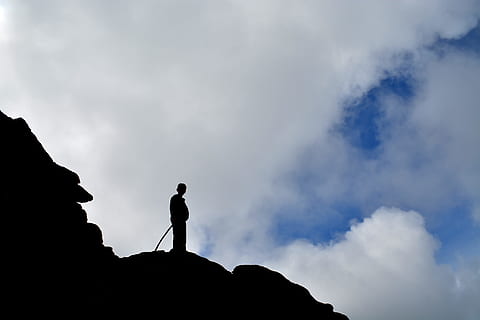 sky, mountain, clouds, blue, children, hiking, silhouette, rock, cloud - sky, rock - object, one person, solid, standing, low angle view, nature, cliff, climbing, leisure activity, activity, outdoors, land, adventure, beauty in nature, mountain peak, at the edge of, 4K, CC0, public domain, royalty free