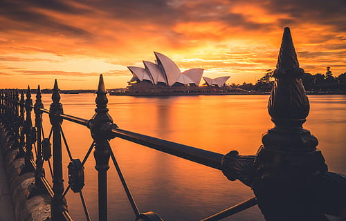 view, sidney opera house, across, water, sunset, clouds, sky, sea, ocean, fence, steel, travel, outdoor, roof, architecture, building, nautical Vessel, famous Place, outdoors, tourism, travel destinations, city, built structure, cloud - sky, nature, transportation, building exterior, reflection, no people, scenics - nature, beauty in nature, 4K, CC0, public domain, royalty free