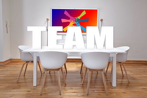 team, standing, letter, white, wooden, table, taken, lighted, room, conference, office, dining tables, chairs, meeting, work, group, cooperation, teamwork, together, collective, community, joint effort, cooperate, personal, team spirit, work with, organization, brainstorming, ideas, zirkel, space, design, wall, board of directors, ground, session, company, indoors, chair, seat, furniture, home interior, flooring, wood - material, no people, wood, hardwood floor, domestic room, modern, business, communication, architecture, white color, sign, nature, living room, apartment, 5K, CC0, public domain, royalty free