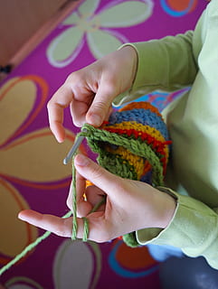 manual work, binding, color, thread, hand, holding, human hand, indoors, child, childhood, one person, human body part, real people, art and craft, women, wool, focus on foreground, craft, knitting, creativity, knitting needle, close-up, high angle view, finger, innocence, 2K, CC0, public domain, royalty free