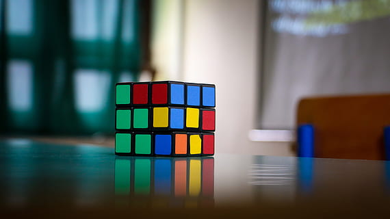 multicolored, 3x3, 3 x 3 rubik, cube, wooden, surface, colorful, object, puzzle, rubik, table, multi colored, indoors, toy, focus on foreground, choice, no people, reflection, variation, close-up, blue, glass - material, block, still life, transparent, group of objects, wood - material, order, office, 4K, CC0, public domain, royalty free