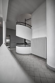 stairs, black-and-white, architecture, inside, black and white, empty, indoors, minimalism, monochrome, spiral staircase, flooring, domestic room, built structure, no people, absence, day, modern, architectural column, ceiling, wall - building feature, building, furniture, lighting equipment, seat, white color, tiled floor, electric lamp, luxury, 5K, CC0, public domain, royalty free
