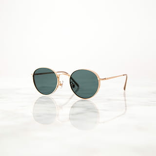 gold-colored, framed, hippie sunglasses, white, surface, gray, lens sunglasses, background, glasses, reflection, marble, table, shade, sunglasses, fashion, personal accessory, copy space, glass - material, close-up, still life, protection, transparent, indoors, security, eyeglasses, white background, single object, no people, eyewear, eyesight, focus on foreground, 2K, CC0, public domain, royalty free