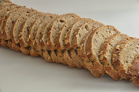 sliced, bread, nuts, food, line, slice, oat, meal, close-up, no people, indoors, white background, loaf of bread, freshness, day, food and drink, baked, studio shot, single object, wellbeing, healthy eating, brown, cereal plant, still life, wheat, cut out, snack, french food, 4K, CC0, public domain, royalty free