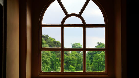 brown, wooden, arc, framed, glass window, glass, trees, window, indoors, looking through window, architecture, day, no people, built structure, sky, glass - material, transparent, nature, plant, tree, building, window frame, looking, geometric shape, arch, grid, 5K, CC0, public domain, royalty free