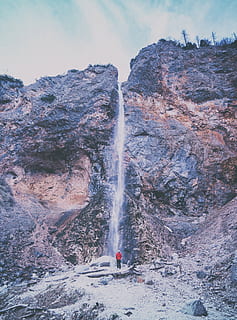adventure, cold, daylight, high, hike, landscape, low angle shot, man, mountain, nature, outdoors, person, rock, rocks, scenic, travel, valley, water, waterfalls, motion, scenics - nature, waterfall, beauty in nature, rock - object, rock formation, solid, leisure activity, lifestyles, long exposure, real people, physical geography, day, mountain range, one person, flowing water, formation, power in nature, falling water, 5K, CC0, public domain, royalty free