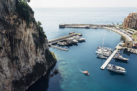 architecture, bay, beach, boat, city, harbor, island, mountain, ocean, outdoors, sea, seashore, ship, town, transportation system, travel, vacation, water, watercraft, nautical Vessel, coastline, transportation, high angle view, mode of transportation, nature, scenics - nature, horizon over water, beauty in nature, day, horizon, travel destinations, sky, no people, built structure, building exterior, 5K