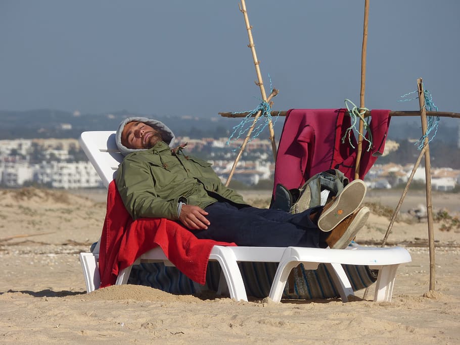 Sleep, Beach, Man, Winter, Sunny, young, sand, relaxation, rest, sea, people, men, travel Locations, outdoors, color Image, full length, one person, adult, one woman only, adults only, only women, sitting, real people, day, nature, land, sky, clothing, leisure activity, lifestyles, sunlight, casual clothing, warm clothing, 2K