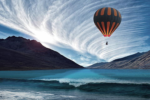 hot, air balloon, blue, sky, daytime, sea, cloud, balloon, wave, tornado, strait, sunset, sun, light, mirroring, mood, assembly, nature, adventure, action, mid-air, hot air balloon, flying, air vehicle, transportation, water, scenics - nature, mountain, beauty in nature, sport, non-urban scene, motion, freedom, travel, outdoors, 4K, CC0, public domain, royalty free