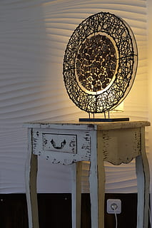 cabinet, table, lamp, light, lighting, art, design, artwork, old, antique, interior design, setup, wall, text, communication, no people, western script, indoors, wall - building feature, architecture, built structure, metal, technology, pattern, day, sunlight, circle, close-up, information, wood - material, sign, ceiling, floral pattern, 5K, CC0, public domain, royalty free