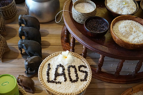 Laos, Land, Tableware, Grain, Eat, Food, indoors, store, no people, retail, sweet food, candy, table, text, still life, freshness, wood - material, food and drink, high angle view, close-up, representation, bowl, western script, indulgence, baked, animal representation, communication, creativity, script, temptation, 5K, CC0, public domain, royalty free