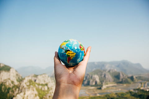 person, holding, blue, globe, global, map, round, colorful, outdoor, hand, palm, view, sky, mountain, highland, landscape, human hand, human body part, environment, nature, day, globe - man made object, clear sky, one person, copy space, body part, mountain range, outdoors, human limb, 5K, CC0, public domain, royalty free
