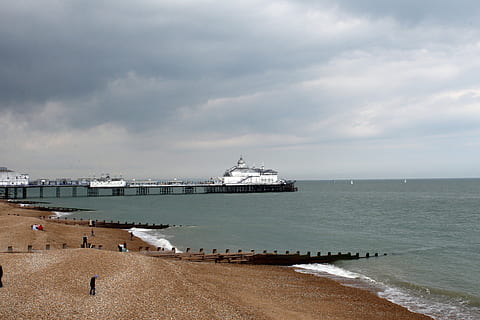 Beach, Dock, Dockside, Eastbourne, blue, groin, holiday, jetty, ocean, pier, quay, quayside, sea, stones, stony, surf, waves, wharf, water, nature, sky, nautical vessel, transportation, ship, cloud - sky, land, mode of transportation, architecture, travel destinations, horizon over water, harbor, horizon, travel, people, passenger craft, cruise ship, 2K, CC0, public domain, royalty free