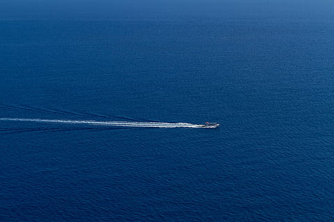 boat sailing, ocean, daytime, sea, blue, water, nature, boat, sailing, transportation, mode of transport, speed, wake - water, day, nautical vessel, outdoors, no people, motion, mode of transportation, on the move, high angle view, beauty in nature, wave pattern, scenics - nature, travel, sailboat, yacht, 5K