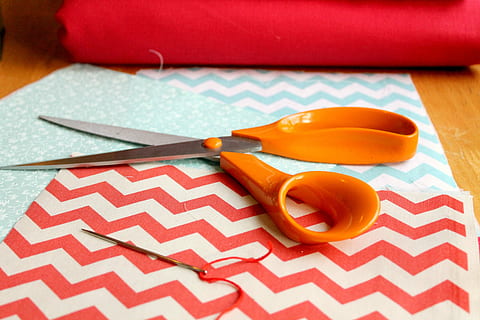 orange, scissors, red, white, paper, sewing, fabric, thread, material, textile, craft, needlework, handmade, sew, needle, hobby, no people, table, indoors, still life, close-up, tablecloth, kitchen utensil, wood - material, art and craft, group of objects, pattern, focus on foreground, eating utensil, household equipment, place setting, paintbrush, colored background, small group of objects, 2K, CC0, public domain, royalty free