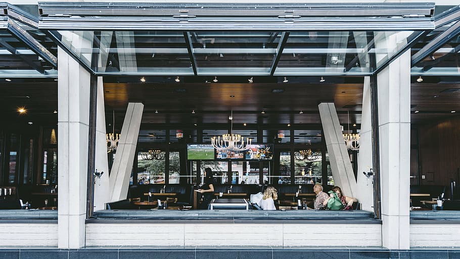 people inside restaurant, architecture, building, infrastructure, restaurant, store, indoors, built structure, retail, building exterior, day, no people, city, glass - material, real people, group of people, street, incidental people, women, business, entrance, reflection, outdoors, office, people, men, architectural column, 5K