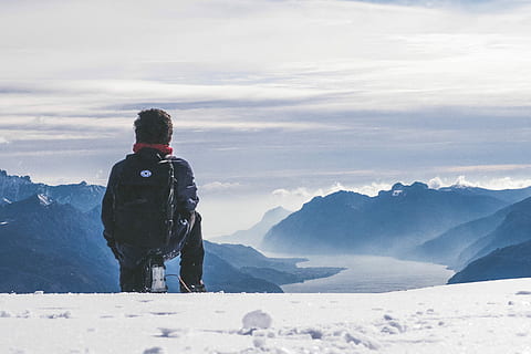 man, carrying, black, backpack, sitting, snow, covered, mountain peak, back, landscape, layers, nature, winter, cold temperature, rear view, mountain, leisure activity, one person, lifestyles, scenics - nature, real people, beauty in nature, sky, warm clothing, standing, mountain range, day, vacations, hiking, outdoors, looking at view, snowcapped mountain, 4K, CC0, public domain, royalty free