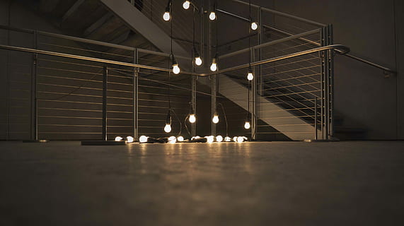 turned, string lights, hanging bulbs, light, modern, window, floor, light bulb, industrial, lightbulb, lit, reflection, staircase, stairwell, rail, steel, concrete, bannister, architecture, illuminated, built structure, lighting equipment, indoors, night, ceiling, transportation, no people, railing, bridge, connection, bridge - man made structure, building, flooring, steps and staircases, low angle view, direction, surface level, 2K, CC0, public domain, royalty free