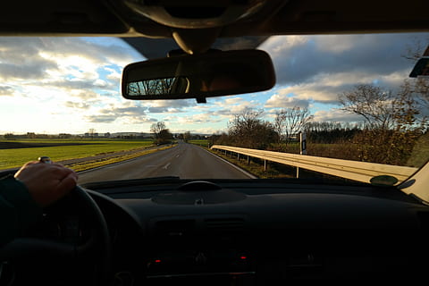 clear road ahead, road, exit, drive, windshield, trip, tour, more, driver, rear mirror, landscape, guard rail, delineator posts, hand, steering wheel, control, car, transportation, travel, land Vehicle, speed, driving, mode of transportation, vehicle interior, car interior, motor vehicle, glass - material, rear-view mirror, transparent, sky, human hand, indoors, one person, on the move, diminishing perspective, car point of view, finger, 5K, CC0, public domain, royalty free