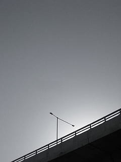grayscale photo, bridge, postl ight, gray concrete bridge, low angle, photo, lamppost, sky, no People, outdoors, bridge - man made structure, low angle view, railing, connection, built structure, architecture, copy space, clear sky, nature, silhouette, transportation, building exterior, day, dusk, street, 2K, CC0, public domain, royalty free