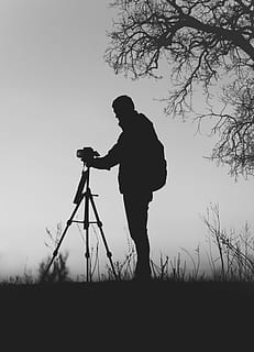 silhouette photo, man, front, dslr camera, tripod, leafless tree, silhouette, holds, tripod camera, daytime, camera, camera - Photographic Equipment, photographer, equipment, people, one Person, standing, men, working, outdoors, black Color, adults only, one man only, adult, real people, full length, sky, photography themes, plant, field, lifestyles, nature, photographic equipment, side view, leisure activity, land, clear sky, digital camera, 4K, CC0, public domain, royalty free