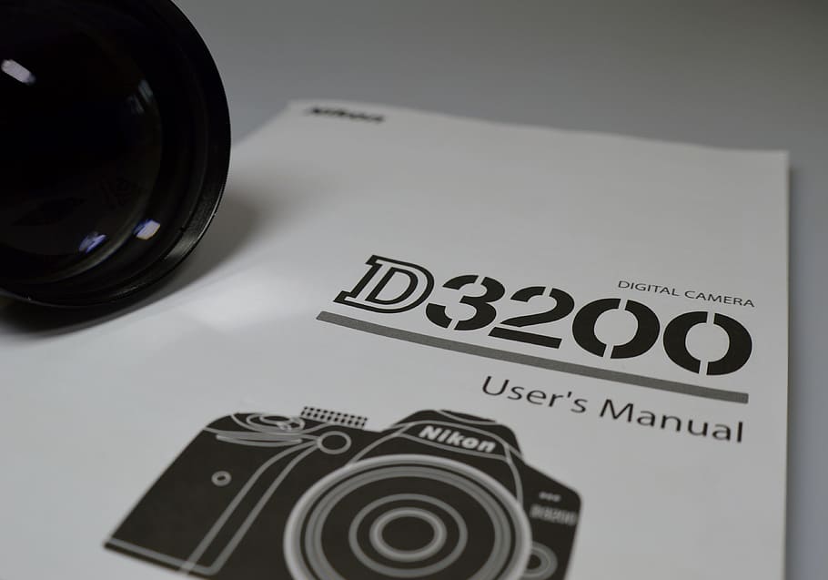 nikon, d3200, càmera, manual, text, guió occidental, comunicació, cap gent, a l'interior, primer pla, natura morta, tir de l'estudi, taula, tecnologia, temes de fotografia, càmera - equip fotogràfic, creativitat, paper, cultura i entreteniment artístic, vista d’angle alt, còpia espai, grup d'objectes, color negre, 4K