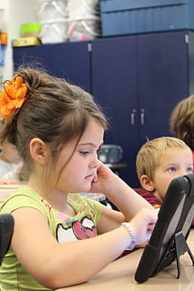 girl, using, tablet computer, ipad, digital, technology, tablet, computer, touchpad, screen, young, working, school, classroom, child, childhood, girls, females, women, portrait, headshot, indoors, sitting, side view, people, boys, lifestyles, offspring, looking, real people, education, males, innocence, pre-adolescent child, 5K, CC0, public domain, royalty free