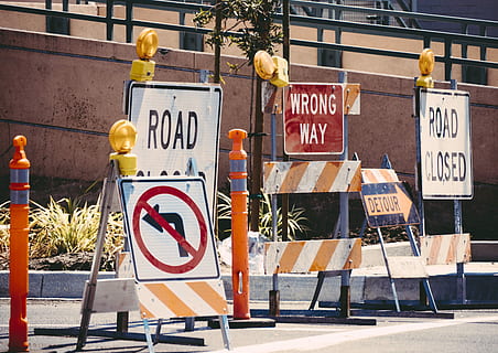 assorted-color signage lot, road, daytime, assorted street signage, road work, sign, closed, construction, traffic, road closed, wrong way, car, detour, roadwork, cartel, señal de tráfico, communication, text, western script, architecture, city, street, warning sign, information, information sign, road sign, building exterior, day, no people, guidance, built structure, script, safety, sunlight, outdoors, exclusion, 5K, CC0, public domain, royalty free