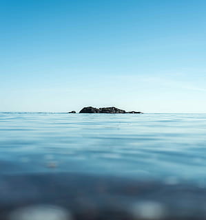 rock formation, center, body, water, fade, horizontal, lonely, alone, lone, distant, black, rocky, deep, dark, blue, cold, relfection, rock, superior, lake, sea, sky, scenics - nature, beauty in nature, tranquil scene, no people, nature, tranquility, clear sky, day, waterfront, selective focus, copy space, land, outdoors, surface level, idyllic, horizon over water, marine, 5K, CC0, public domain, royalty free