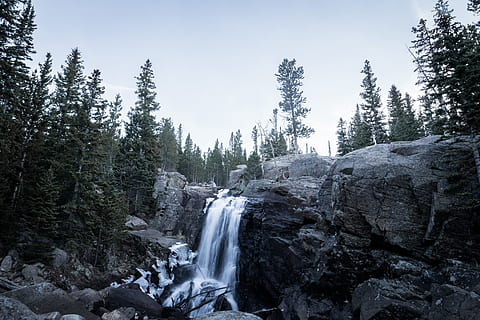 timelapse photography, surrounded, trees, blue, sky, daytime, waterfalls, pine tree, Four Lakes, Waterfall, tree, pine, forest, ice, nature, landscape, scenics, river, water, snow, mountain, outdoors, winter, beauty In Nature, flowing Water, rock - Object, stream, no People, cold - Temperature, wilderness Area, cold temperature, plant, scenics - nature, land, rock, solid, environment, motion, long exposure, non-urban scene, blurred motion, coniferous tree, woodland, power in nature, flowing, pine woodland, stream - flowing water, 5K, CC0, public domain, royalty free