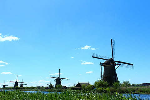 low-angle photography, windmill, kinderdijk, mill, mills, sky, blue, nature, netherlands, wind power, renewable energy, wind turbine, field, alternative energy, turbine, land, environmental conservation, fuel and power generation, plant, environment, built structure, cloud - sky, traditional windmill, grass, no people, architecture, outdoors, sustainable resources, 5K, CC0, public domain, royalty free