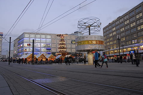 watch, piazza, time, timetable, clock tower, architecture, now, berlin, built structure, building exterior, city, group of people, real people, street, building, sky, large group of people, crowd, cable, city life, outdoors, men, walking, nature, lifestyles, electricity, city street, office building exterior, 4K, CC0, public domain, royalty free