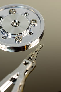 hard drive, hdd, hardware, computer, disk, macro, data store, technology, read heads, inner workings, component, chip, it, magnetic heads, sata, board, digital, data processing, motherboard, print heads, magnetic data storage, data, cut out, stylus, edp, detail, memory chip, metal, indoors, no people, close-up, shiny, studio shot, single object, arts culture and entertainment, silver colored, music, reflection, circle, equipment, high angle view, selective focus, still life, gray, geometric shape, electrical equipment, 2K, CC0, public domain, royalty free