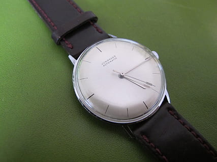 clock, junghans, automatic, time, green color, instrument of time, watch, no people, close-up, high angle view, wristwatch, accuracy, still life, roman numeral, technology, indoors, day, number, leather, metal, personal accessory, minute hand, 2K, CC0, public domain, royalty free